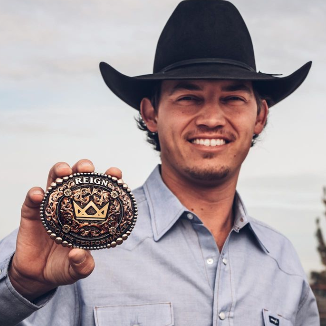 Western Belt Buckles - Cowboy holding buckle